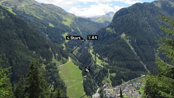 A beautiful mountain landscape with a clear sky. The marked route indicates the starting and ending point near a small mountain village.