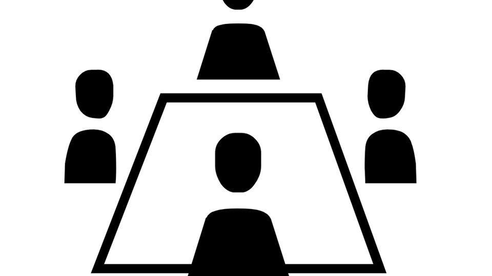A simple symbol shows a meeting table with several people. The graphic illustrates an exchange or a discussion in a conference room.
