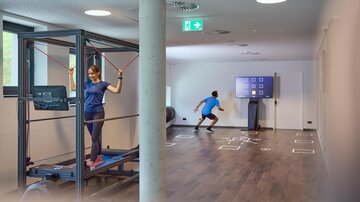 A modern training environment with two people. One person is using a fitness device while the other is actively running towards a screen.