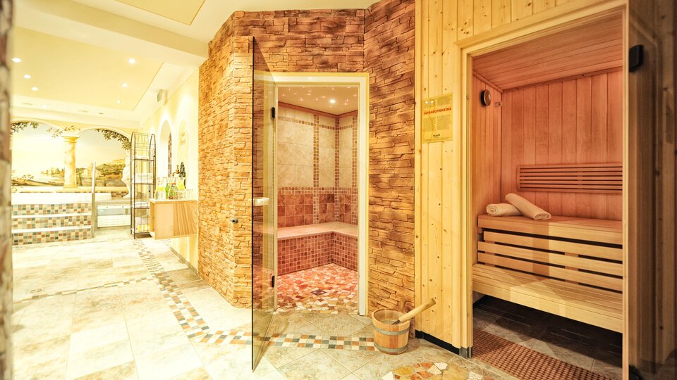 A relaxing wellness area with two saunas. The room has a warm, inviting character and is designed with natural materials.